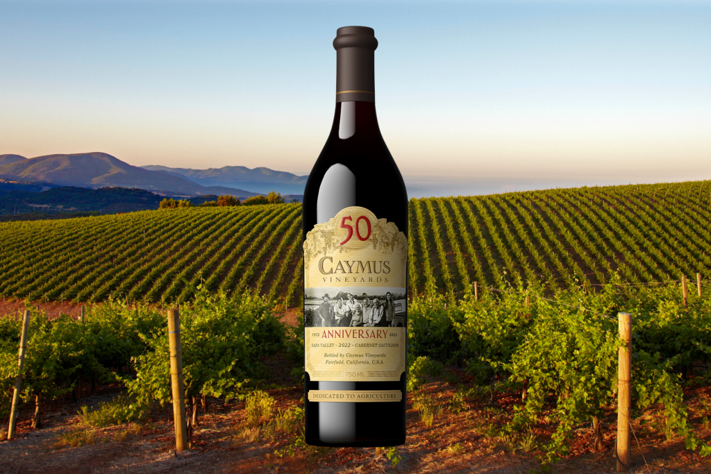 The 50th anniversary wine from Caymus Vineyards in front of a lush vinyard